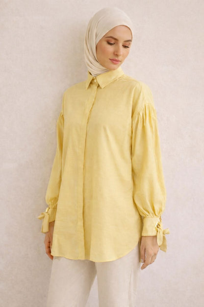 Elegante Bluse mit Ballonärmel und Ösendetail - Gelb